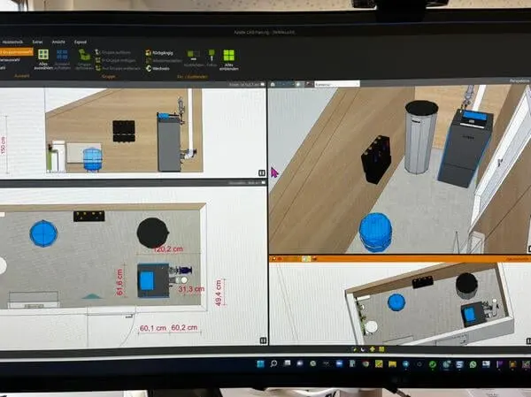 Monitor mit CAD-Planungssoftware: Grundriss eines Heizungsraums mit Maßangaben sowie 3D-Ansichten der Heiztechnik